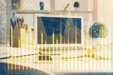 Forex market graph hologram and personal computer on background. Double exposure. Concept of investment.