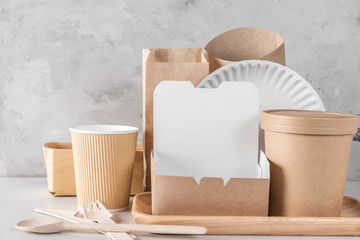 Eco friendly disposable tableware. Paper cups, dishes, fast food containers and bamboo wooden cutlery.
