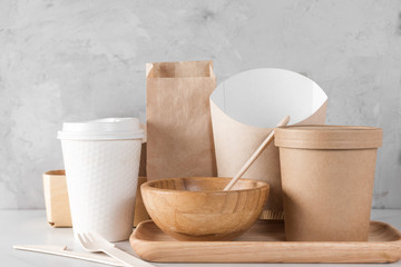 Eco friendly dishes. Disposable paper cups, dishes, fast food containers, wooden bowl and bamboo cutlery