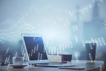 Forex graph hologram on table with computer background. Multi exposure. Concept of financial markets.