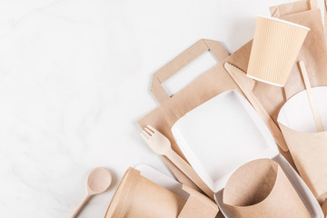 Eco friendly disposable tableware. Paper cups, dishes, fast food containers and bamboo wooden cutlery. flat lay
