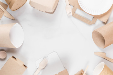 Frame made of eco friendly disposable tableware. Paper cups, dishes, fast food containers and bamboo wooden cutlery