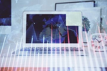 Stock market chart hologram drawn on personal computer background. Double exposure. Concept of investment.