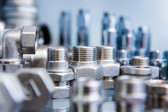 Hosepipe fittings on the table. Plumbing pipeline spare parts.