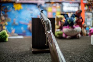 Silver rifle for target shooting in a shooting range in the amusement Park close-up in the evening