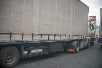 Truck closeup standing in a queue among the other large machines day