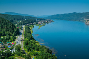 Beautiful view on Enisei rive, hills and mountains at Divnogorsk town viewpoint, Siberia, Russia