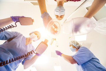 Doctors give resuscitation to a male patient in the emergency room. Cardiac massage