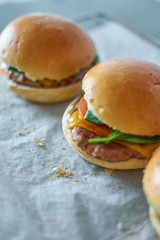 Homemade hamburguers on baking paper