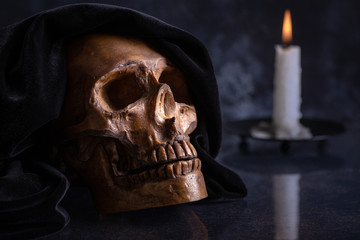 Hooded Halloween Skull and Burning Candle