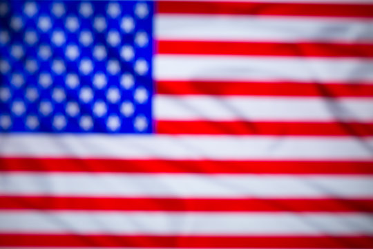 Blurred US flag close up. Developing in the wind.