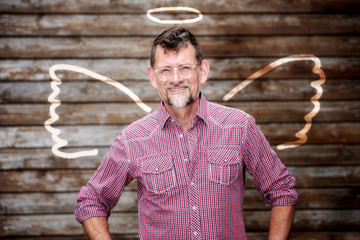 handsome businessman with drawn angel wings
