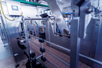 Bottling line of sunflower oil in bottles. Vegetable oil production plant. High technology.