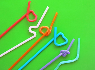 Colour plastic cocktail tubes with a flexible part, due to which they can be twisted into a knot or...