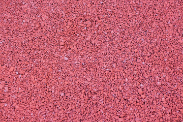 Fototapeta premium Red stone, pebbles. Texture. Background.