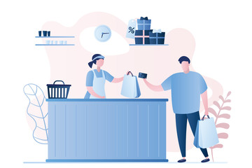 Male buyer and female seller in a store, payment by card,man character with shopping bags