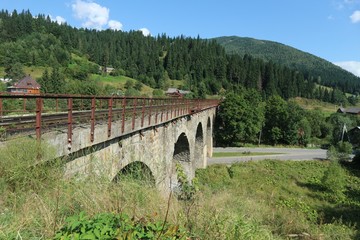 Bridge viaduct on a background of mountains