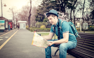 Tourist lost in a city checking maps and calling a friend - Unfriendly tourist infrastructure destinations
