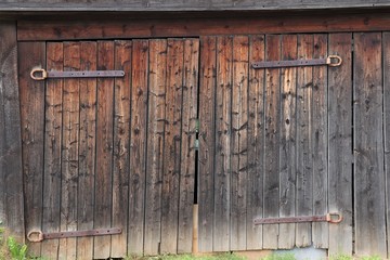 old wooden gate with iron hinges