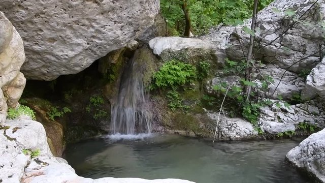 Nature landscape of a waterfall and beautiful pool of fresh water in Nidri, Lefkada ionian island in Greece