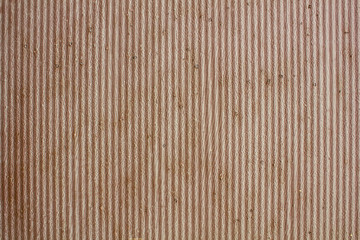 old rusty gray brown wavy metal wall with peeling paint. vertical lines. rough surface texture