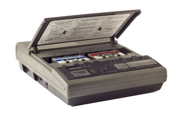 old vintage answering machine with two small tape cassettes isolated on white background