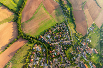 Aerial view at a landscape in Germany, Rhineland Palatinate near Bad Sobernheim with the river Nahe, meadow, farmland, forest, hills, mountains