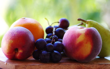 close up ofpeaches, grapes and fruits