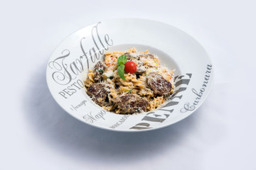 A high contrast Hero shot of a Meat & sprinkled Cheese Pasta, on a minimal white background with a 45 degree angle from zoomed out frontal perspective