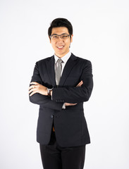 Obraz na płótnie Canvas Smart boss, smiling businessman wearing glasses against white wall in studio