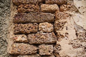 background image, wall made of brown stone in the past 