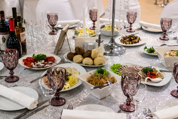 Food and beverages on decorated wedding party in restaurant