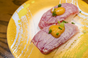 Aburi salmon sushi or Aburi sake nigiri in Japanese style fresh serve on yellow plate. healthy food. Japanese traditional food