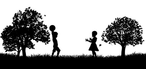 Fototapeta na wymiar Two children, a boy and a girl, playing throw and catch in a park in silhouette
