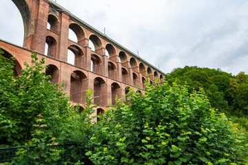 Fototapeta premium Mylau, Saxony, Germany. The Goeltzschtalbridge, the largest brick-built bridge in the world, is a major tourist attraction of the region