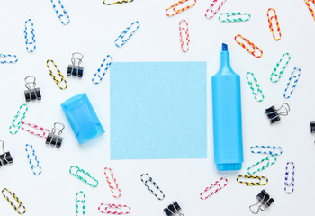 Stationery office supplies. Paper clip, felt-tip pen, memo piece of paper on white background