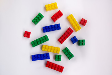 Multi-colored Plastic building blocks isolated on white background, Top view with copy space
