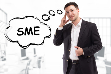 Business, technology, internet and network concept. The young businessman comes up with the keyword: SME