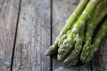 Bunch of fresh asparagus on wooden table