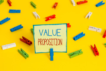 Text sign showing Value Proposition. Business photo text feature intended to make a company or product attractive Colored clothespin papers empty reminder yellow floor background office