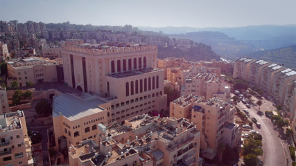 Naklejka premium Jerusalem Belz Great Orthodox Synagogue Aerial view Drone footage over Large Orthodox synagogue in Jerusalem Israel