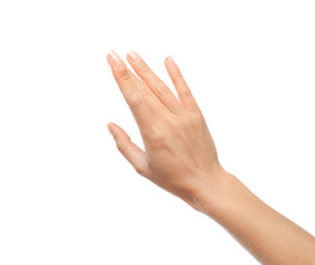 Young woman held out hand on white background, closeup