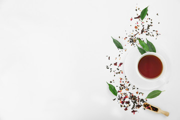 Composition with tea on white background, top view