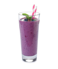 Glass of delicious blueberry smoothie with mint and straw on white background
