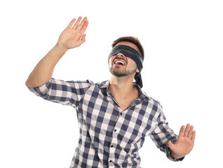 Naklejka premium Young man with black blindfold on white background