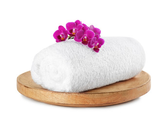 Fototapeta na wymiar Tray with orchid and towel on white background. Spa treatment