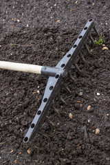 Loosening the excavated ground with a rake close-up