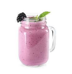 Delicious blackberry smoothie in mason jar on white background
