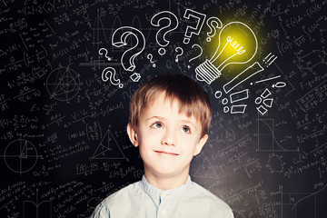 School boy with lightbulb on background. Science idea concept wi
