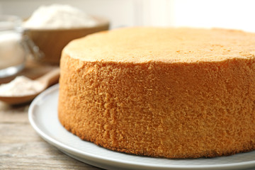 Delicious fresh homemade cake on wooden table, closeup